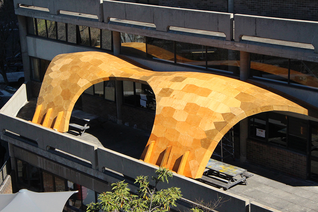 Yellow canopy over outdoor seating area