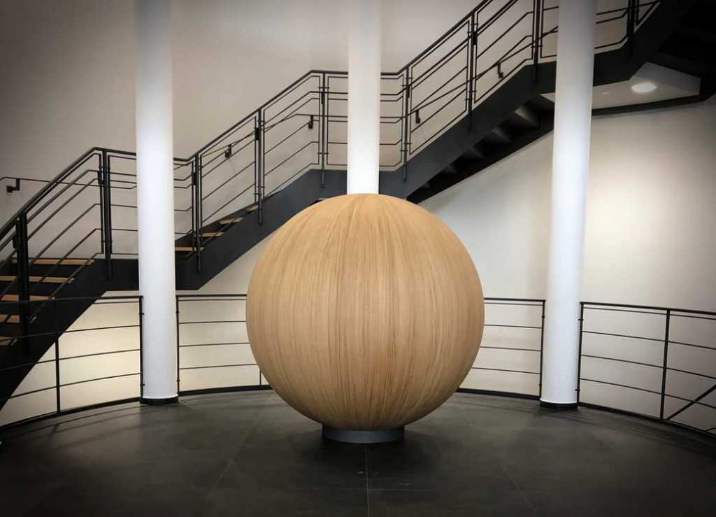Wood ball art in middle of room